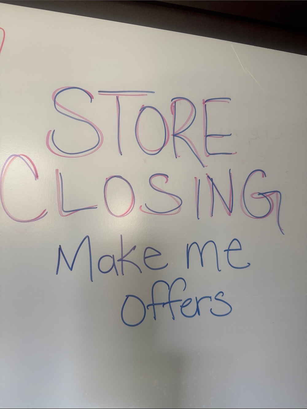 White Dry Erase Board with Pink and Blue Marker Writing
